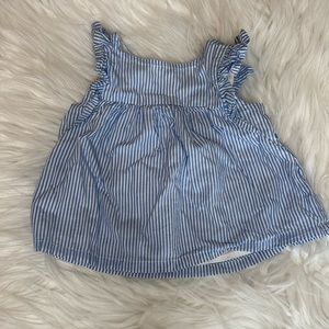 Blue and white pin striped top with bottom closure in back